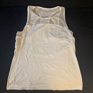 Beautiful white tank top with beautiful sheer detail in the front and racerback.